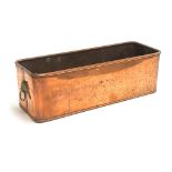 A rectangular copper trough planter with twin lion mask handles, 43cmW