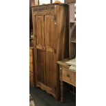 An oak single wardrobe with linen fold panel door, 68x42x175cmH