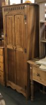 An oak single wardrobe with linen fold panel door, 68x42x175cmH