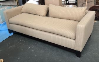 A contemporary three seater sofa upholstered in a beige pinstripe fabric, 220x92x70cmH