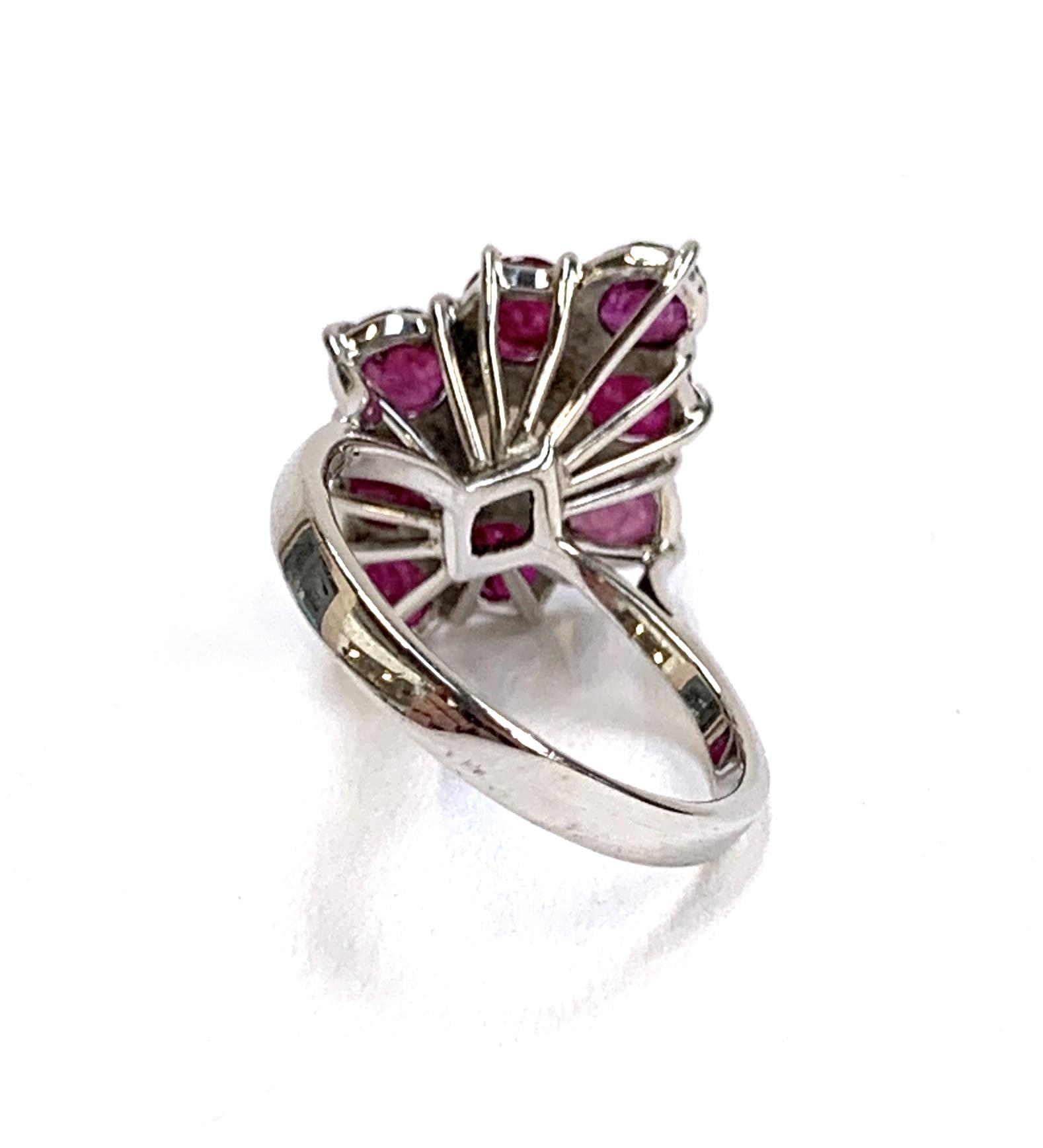 A 9ct white gold ring set with a navette form cluster of rubies and a central opal, size J, 3.2g - Image 3 of 3