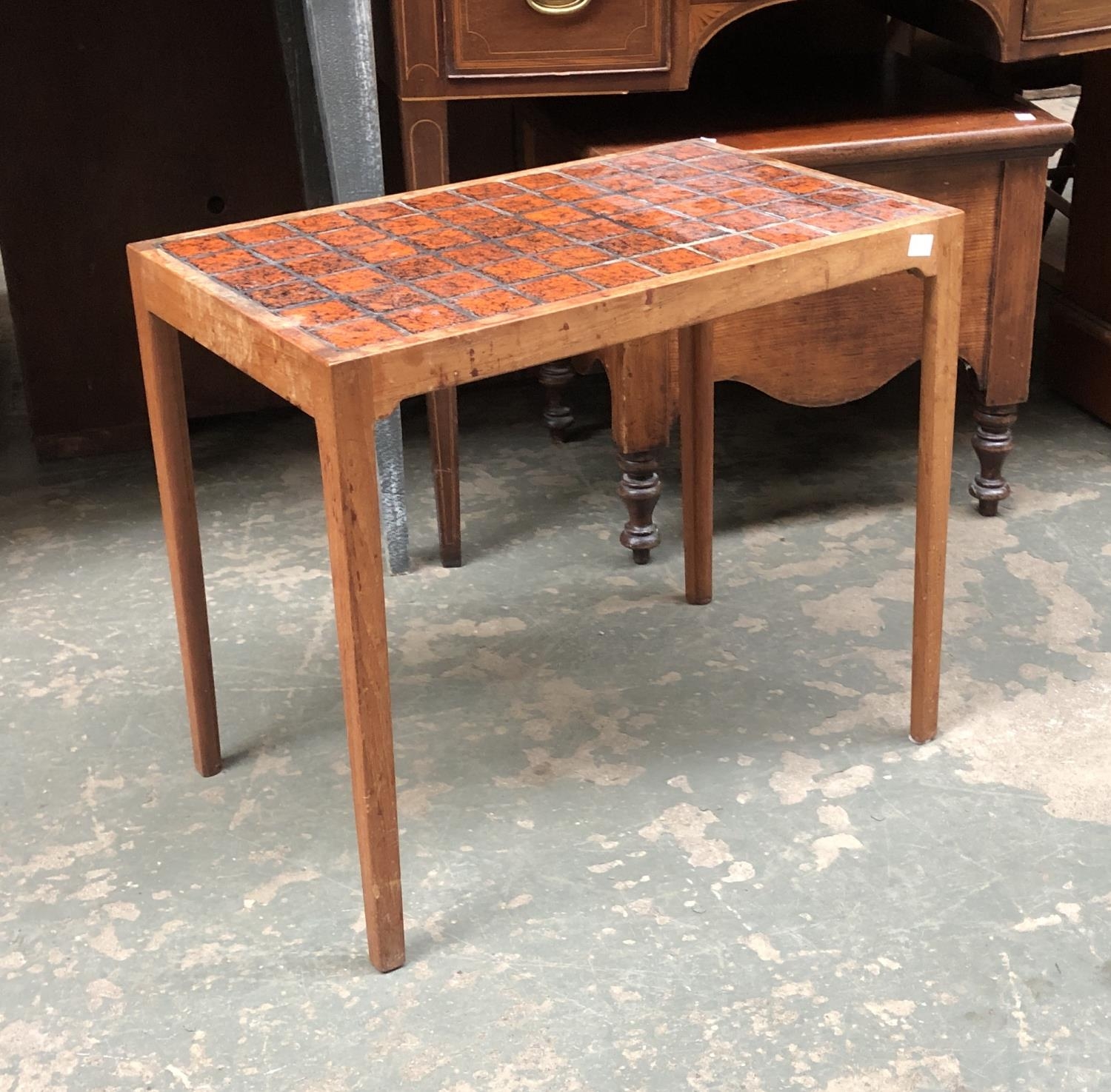 A mid century teak and tile topped occasional table, 56x35x48cmH