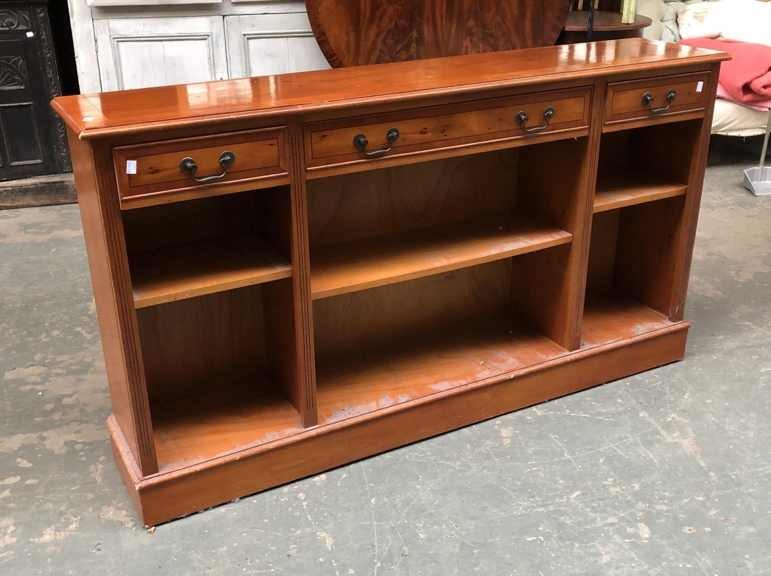 A yew veneer low bookcase with three drawers, 153x31x84cmH