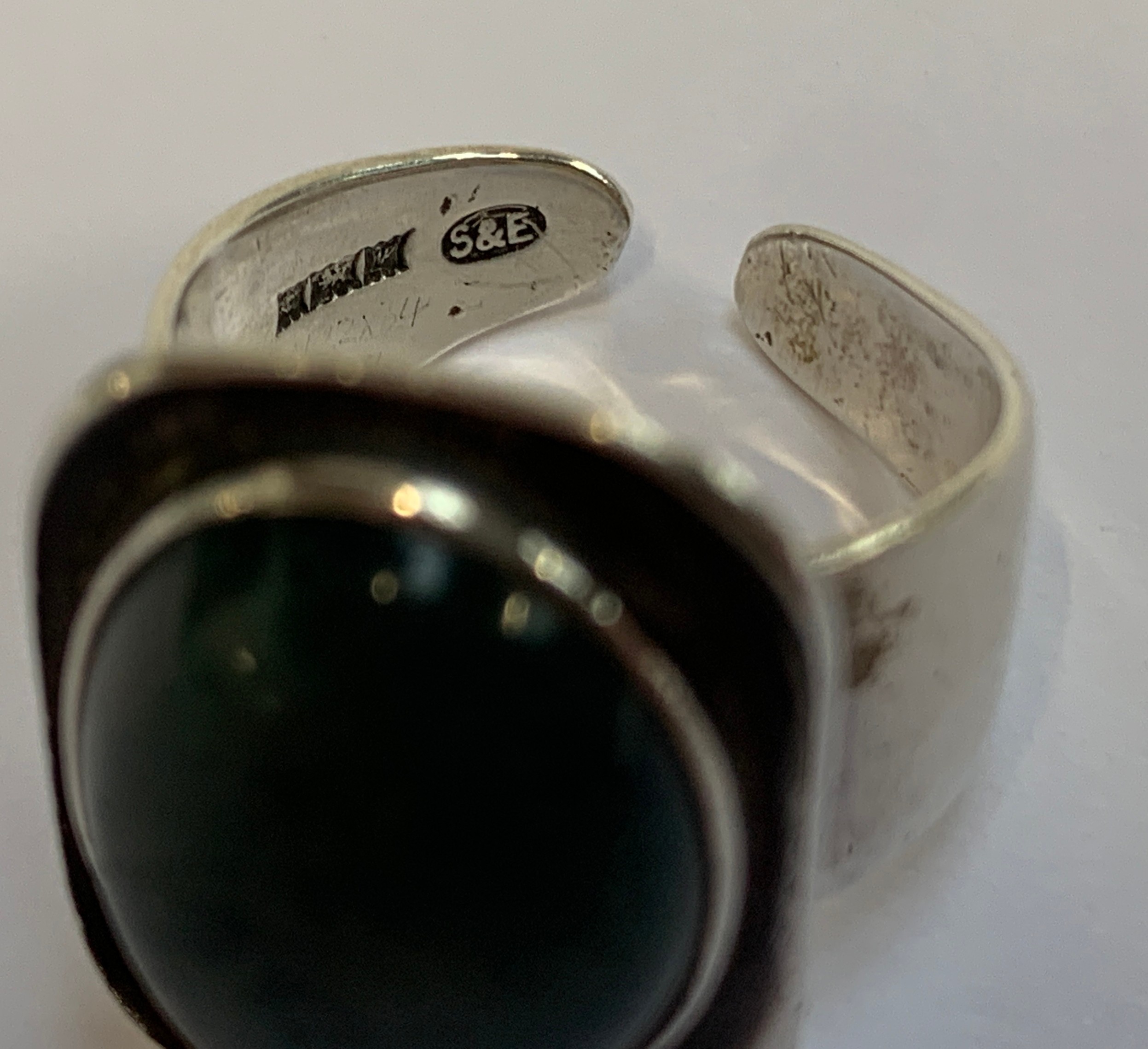 A silver 1970s Modernist ring set with a moss agate cabochon, hallmarked for Smith & Ewen, - Image 2 of 2
