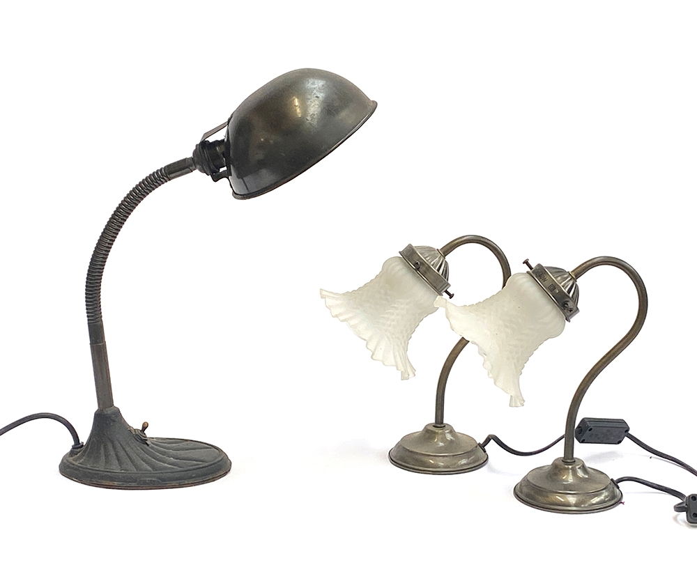 An industrial style posable desk lamp, together with two brush metal effect table lamps with frosted