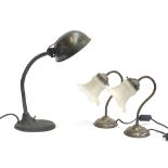 An industrial style posable desk lamp, together with two brush metal effect table lamps with frosted