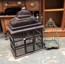 A wooden bird cage, 44x28x70cmH; together with a further green painted small metal birdcage
