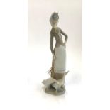 A Lladro figure of a woman with two geese, approx. 27cmH