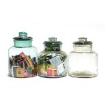 Three glass kitchen storage jars, 33cmH and 29cmH