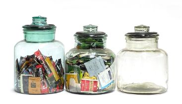 Three glass kitchen storage jars, 33cmH and 29cmH