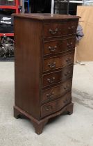 A serpentine mahogany chest of seven drawers, 49x40x100cmH