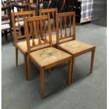 A set of four Georgian revival satin mahogany and line inlaid side chairs, each with three