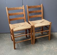 A pair of Scandinavian pine and rattan ladderback side chairs