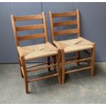 A pair of Scandinavian pine and rattan ladderback side chairs