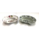 Two ceramic shaving dishes, both with floral designs, with staple repairs, 30cmW & 33cmW (af)