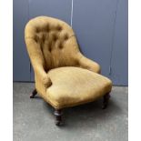 A 19th century button back slipper chair, yellow upholstered, with turned front legs and casters,