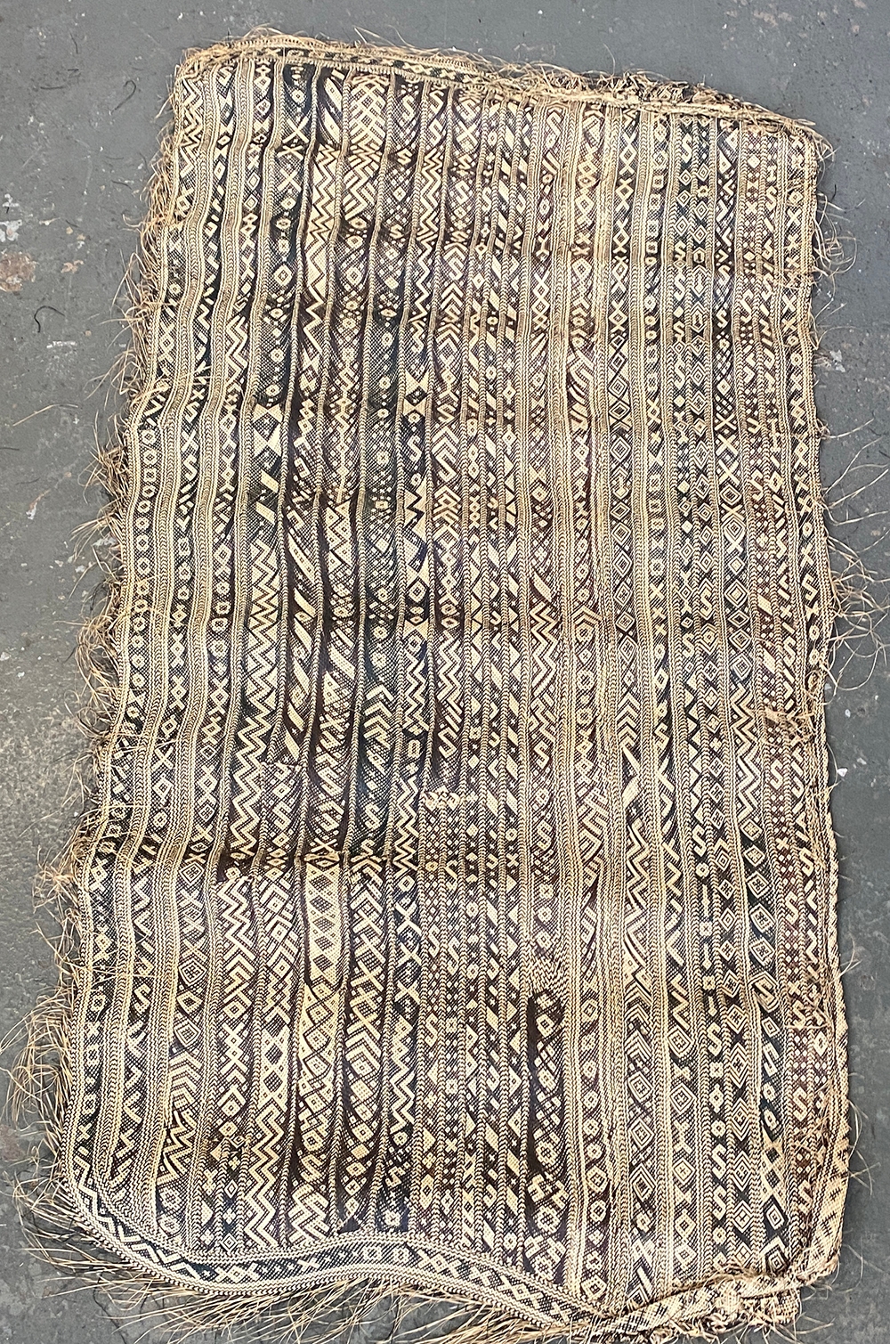 A 19th/early 20th century woven straw tribal mat, 190x100cm