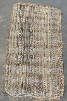 A 19th/early 20th century woven straw tribal mat, 190x100cm