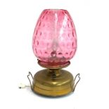A 'Strawberry' oil lamp, converted for electrical use, with glass chimney and shade, brass