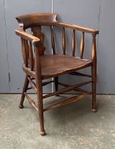 A stained beechwood open armchair, the two part arm joined by a collar, 61cmW