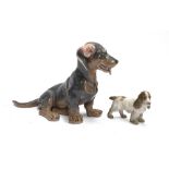 Two Royal Copenhagen figurines: 856 dachshund, and a small spaniel, 18cm high