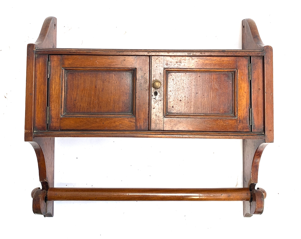 A 19th century mahogany wall shelf, two cupboards with towel rail below, 48.5cmW