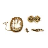 A gilt metal mounted shell cameo depicting the Three Graces; yellow metal floral bar brooch brooch