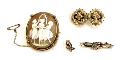 A gilt metal mounted shell cameo depicting the Three Graces; yellow metal floral bar brooch brooch