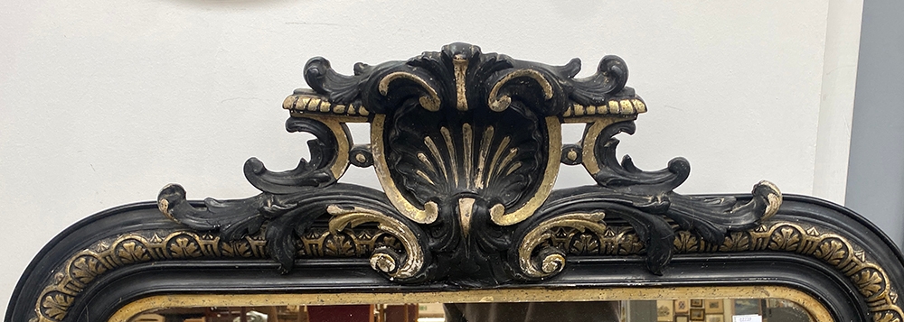 A large guilt and ebonised over mantle mirror, with shell cresting, 84x150cm - Image 2 of 2