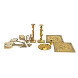 A mixed lot of metal items to include brass candlesticks; brass plaques; brass Art Nouveau style