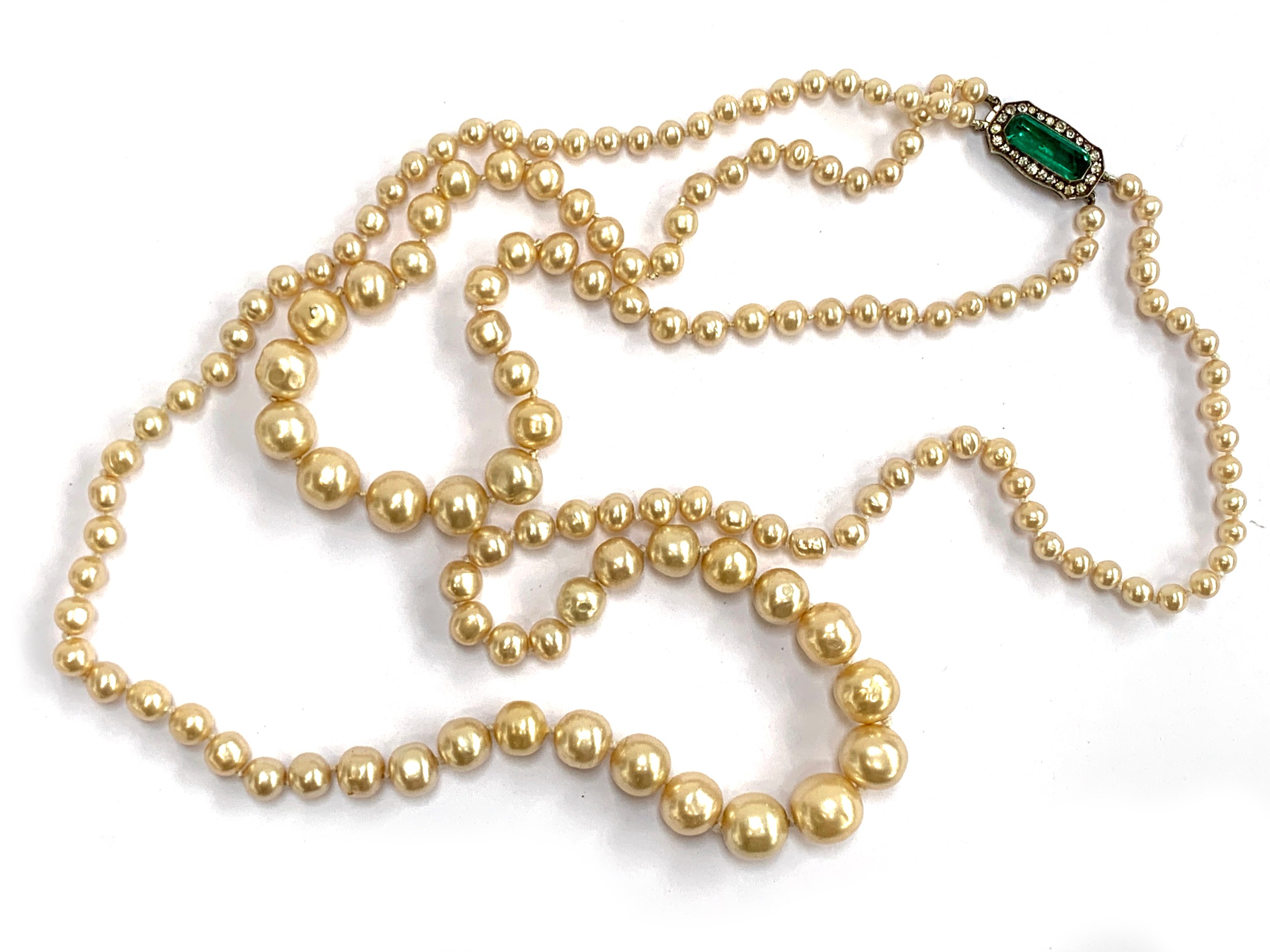 An early 20th century good quality faux pearl double strand necklace, fastening with a silver