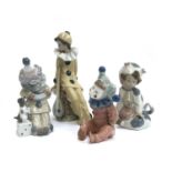 Four Lladro figurines, three stamped Nao, to include child dressed as cow, no. 1415, child dressed