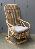A bamboo conservatory cantilever rocking chair
