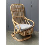 A bamboo conservatory cantilever rocking chair