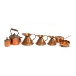 A quantity of copper items to include graduating set of three jugs; saucepan with lid; footed