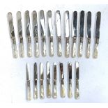 A quantity of Victorian mother of pearl handled and silver collared knives, the blades engraved '