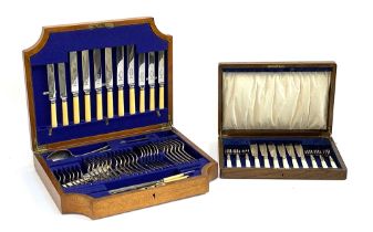 An oak cased canteen of flatware for six place settings, the knives by Robert M. Slater; together