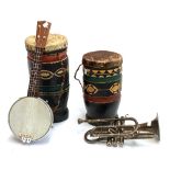 Two hide drums; a banjolele; and a cornet