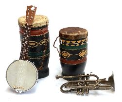 Two hide drums; a banjolele; and a cornet