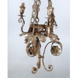 A Continental painted wrought metal three light chandelier, of scrolling form, 47cm high.