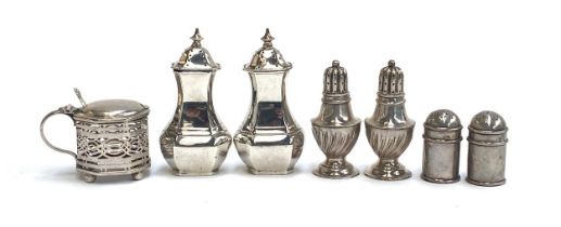 Three pairs of silver peppers, the largest by Barker Brothers Silver Ltd, Birmingham 1936;