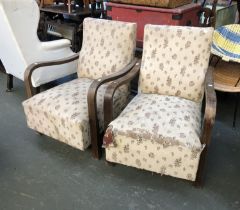 A pair of early 20th century upholstered open armchairs