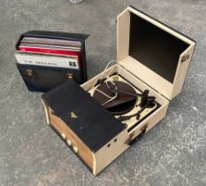 An Argosy portable record player, with Garrard RC120/4H turntable; together with a small quantity of