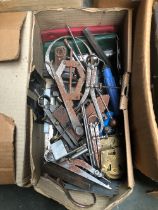 Several boxes of tools comprising various sharpening stones; sockets and spanners; vices etc;