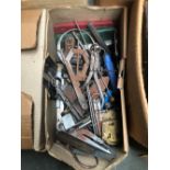 Several boxes of tools comprising various sharpening stones; sockets and spanners; vices etc;