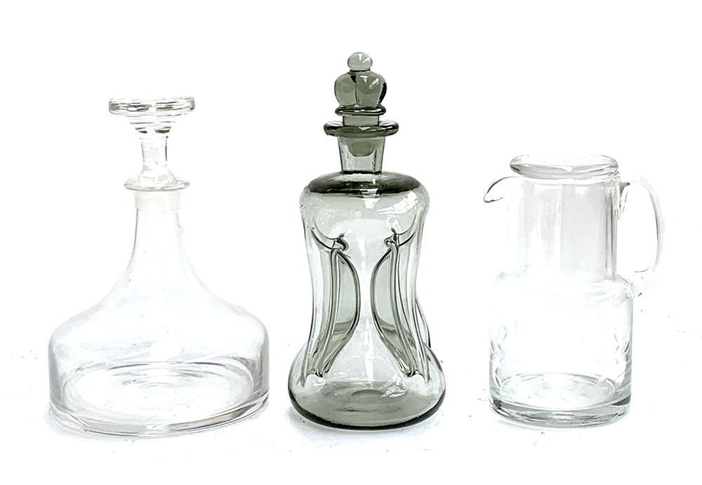 A vintage smoked glass Holmegaard style 'cluck cluck' decanter, 26cmH; a ships decanter and a