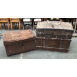 A canvas covered domed travel trunk, 78cmW; together with a further metal travel trunk