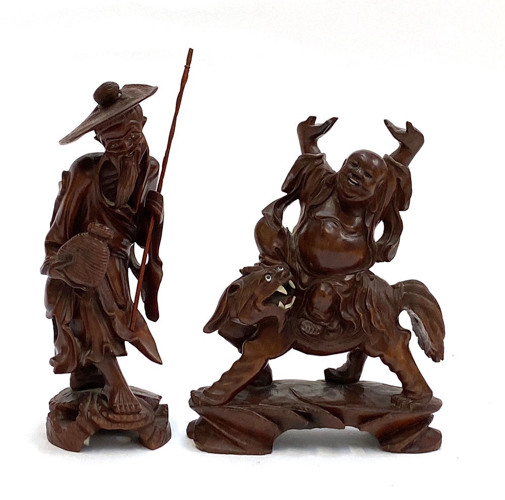 Two Chinese carved root wood figures, one laughing buddha on lion, the other a fisherman, the
