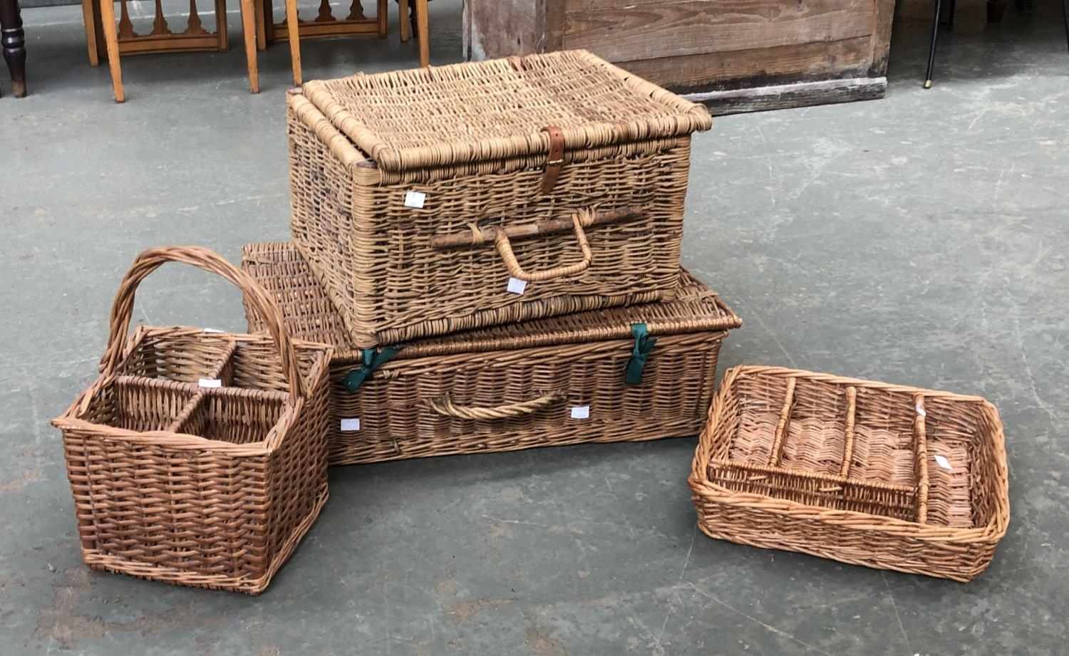 A selection of wicker baskets and hampers: two wicker hampers, 61cmW and 44cmW, together with a