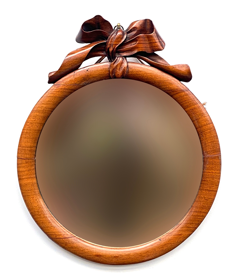 A Victorian mahogany framed circular mirror, with carved ribbon cresting, 38x41cm